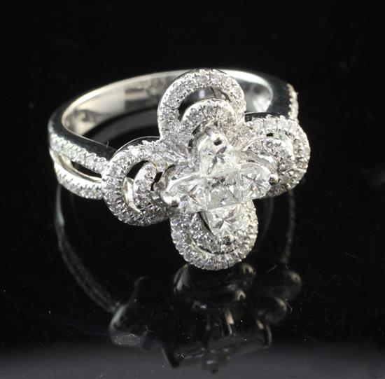 A modern 18ct white gold and diamond cluster dress ring, size O.